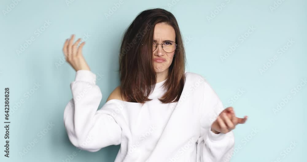 Portrait of thoughtful confused puzzled young woman scratching head while thinking over solution, brunette girl having doubts about difficult choice, isolated on blue studio background. Portrait of thoughtful confused puzzled young woman scratching head while thinking over solution, brunette girl having doubts about difficult choice, isolated on blue studio background.