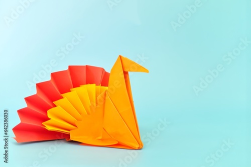 Obraz na płótnie Colorful turkey paper origami isolated on blue background. Happy thanksgiving day. w salonie