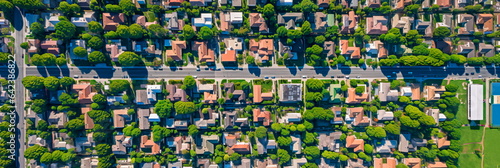 aerial perspective of a peaceful suburban neighborhood, with houses, parks, and tree-lined streets. Generative AI