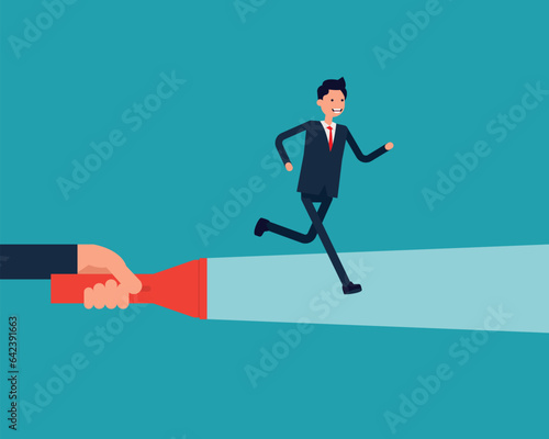 A businessman running on flashlight by big hand
