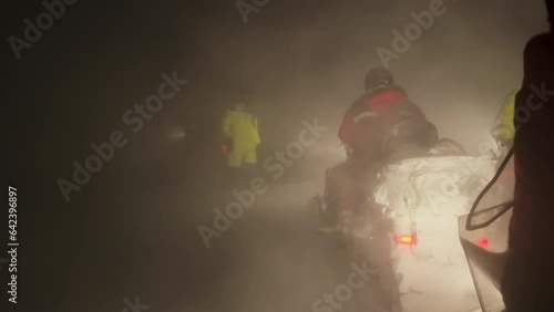 Slow mo. View from the snowmobile at speed. Large snowy field in winter. Evening sunset in Siberia. Red sun at sunset photo