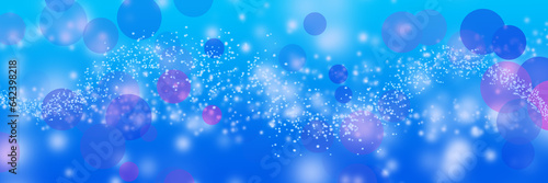 Panorama-sized blue background with milky way bokeh effect.