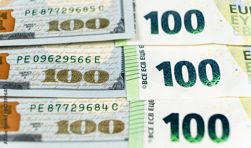100 dollar and 100 euro bills close-up 100 dollar and 100 euro bills close-up