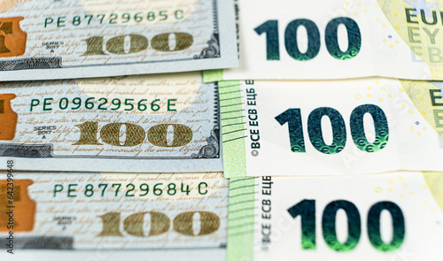 100 dollar and 100 euro bills close-up