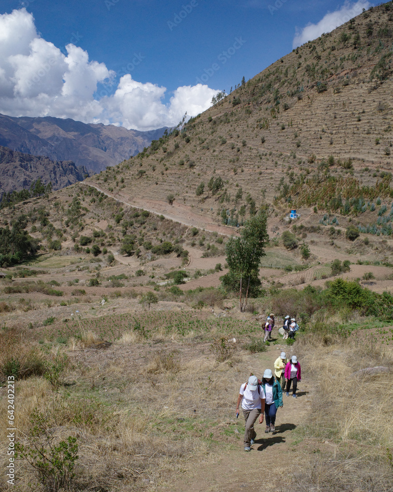 Cusco, Peru - Dec 3, 2022: A group of tourists begin a hike in the Sacred Valley
