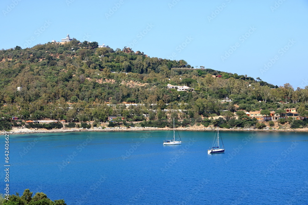 view from the San Gemiliano tower on the rocky coast on the blue sea. Sardinia, Italy. City of Arbatax