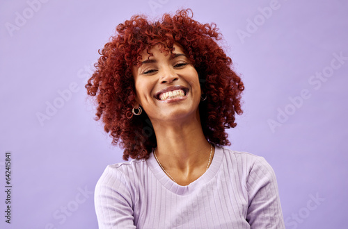 Natural, African beauty and portrait of woman in fashion with confidence, pride and smile on purple background in studio. Happy, face and collagen cosmetics for afro or dermatology skincare in salon