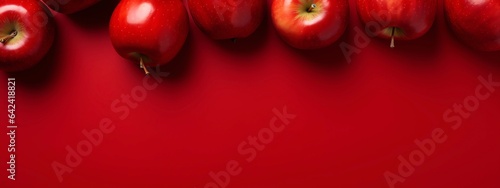 Red apples on red background