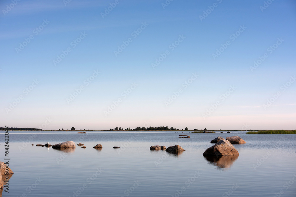Rocks in the water in the beautiful morning sun on the coast of Finland