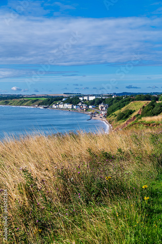 View towards Filey from Filey Brigg on a sunny morning with some cloud
