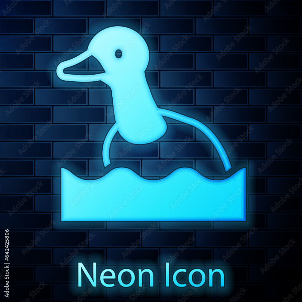 Fotografie Glowing neon Flying duck icon isolated on brick wall background