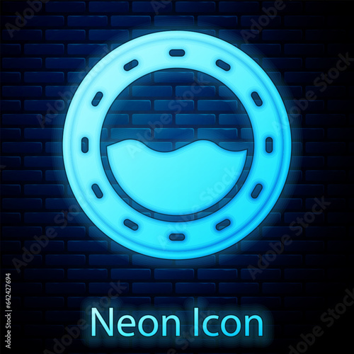 Glowing neon Ship porthole with rivets and seascape outside icon isolated on brick wall background. Vector