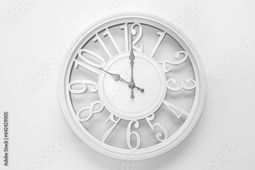 Circle clock on white background wall