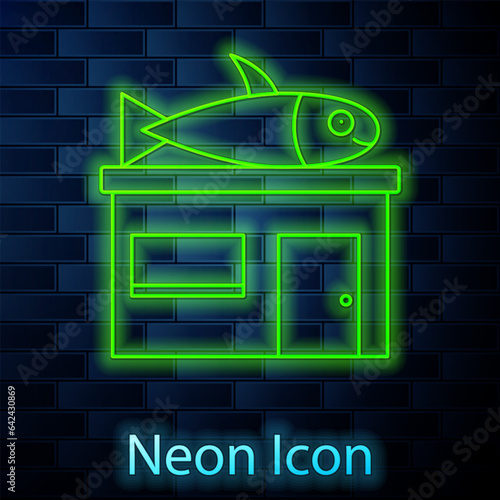 Glowing neon line Seafood store icon isolated on brick wall background. Facade of seafood market. Vector.
