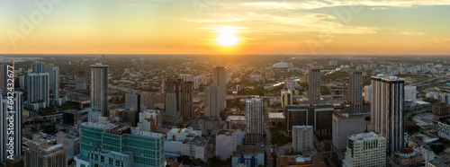 Aerial view of downtown office district of Miami Brickell in Florida, USA at sunset. High commercial and residential skyscraper buildings in modern american megapolis