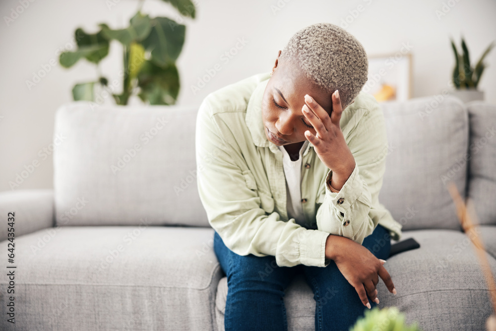 Woman, depression and headache in home for anxiety, mental health and stress of mistake, debt or crisis. Tired, sad and frustrated african person with emotional trauma, broken heart and worry on sofa Woman, depression and headache in home for anxiety, mental health and stress of mistake, debt or crisis. Tired, sad and frustrated african person with emotional trauma, broken heart and worry on sofa