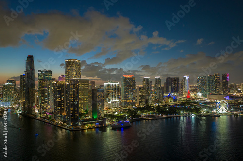 Night urban landscape of downtown district of Miami Brickell in Florida, USA. Skyline with brightly illuminated high skyscraper buildings in modern american megapolis © bilanol