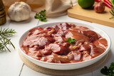 Flesh raw chicken liver meat in white plate, ingredients for cooking