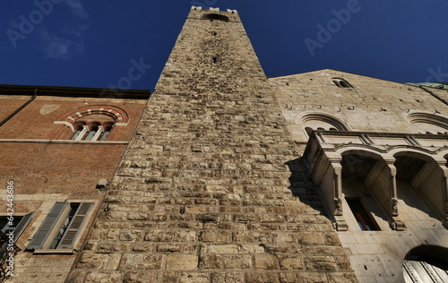 Facades of old town hall Broletto, tower Torre del Pegol, medieval house Loggia delle Grida and cathedral of Brescia in square Piazza Paolo VI. photo