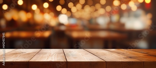 Choose a blank wooden table with a coffee shop backdrop for your photo editing or product showcasing
