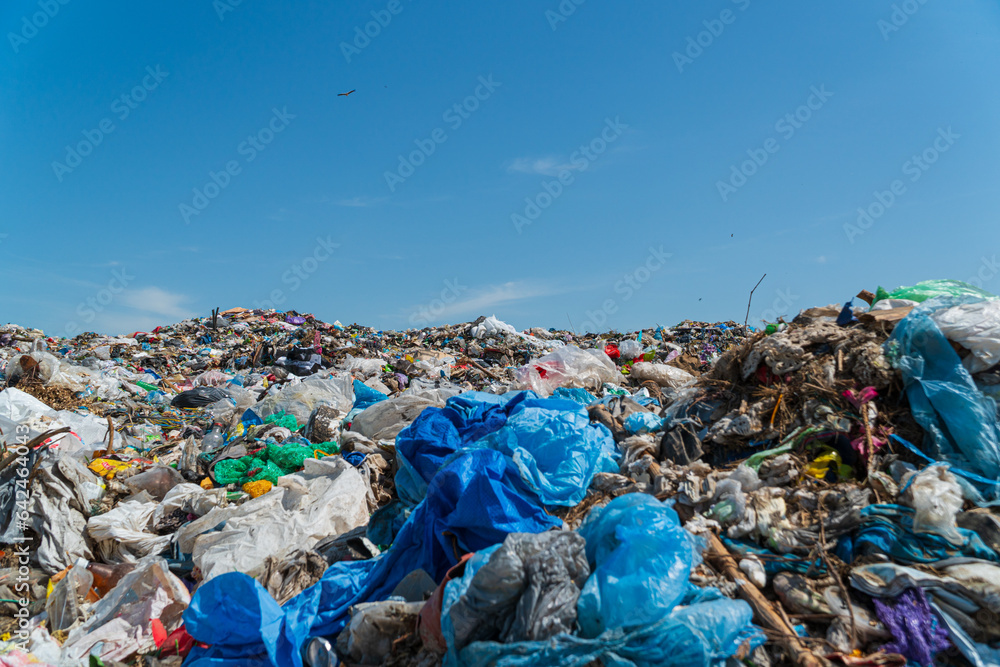 Close-up of household waste lying on a landfill. Polyethylene garbage. Land pollution with household waste