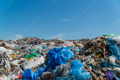 Close-up of household waste lying on a landfill. Polyethylene garbage. Land pollution with household waste