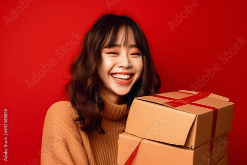 An Asian woman in a red uniform prepares a package for delivery next to a parcel post box. This image features a cheerful delivery woman against a vibrant red background. Generative AI.