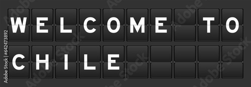 Black color analog flip board with word welcome to chile on gray background