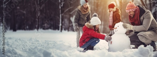 Happy family playing in the snow and making a snowman, copy space. Created with Generative Ai technology.