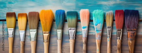 Set of paint brushes with colorful paints