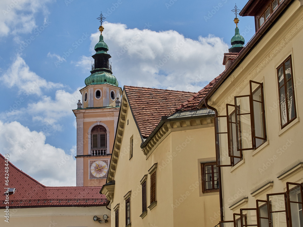 Bell tower of the Cathedral of  Ljubljana with a clock. Church of St. Nicholas. Slovenia, Europe