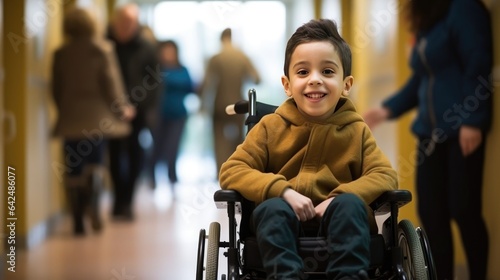Inclusiveness and accessibility of healthcare facilities for children with disabilities. Disabled boy in a wheelchair in the hospital photo