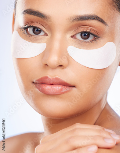 Fototapeta Skincare, beauty and portrait of woman with collagen eye patch for anti aging or skin pad on white background