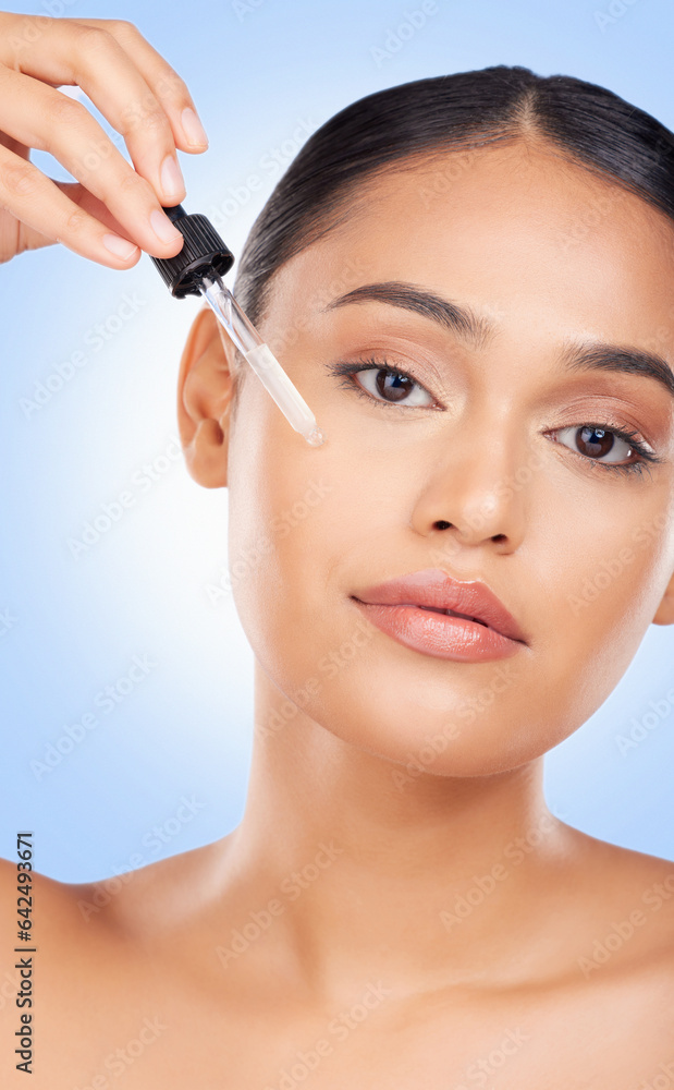 Woman, face and oil serum, beauty and skincare with liquid collagen isolated on blue background. Natural cosmetics, wellness and portrait, dermatology with pipette and hyaluronic acid in a studio Woman, face and oil serum, beauty and skincare with liquid collagen isolated on blue background. Natural cosmetics, wellness and portrait, dermatology with pipette and hyaluronic acid in a studio