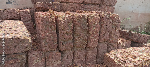 Brick blocks made from laterite stone. Popularly used to decorate gardens. photo