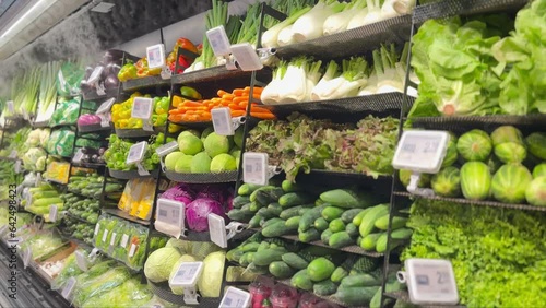 A refrigerated chilly stall of fresh organic vegetables in a grocery o market.
