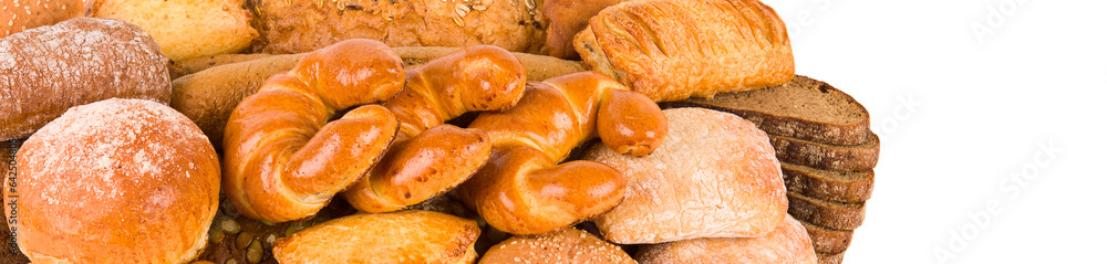 Bread, sweet buns and croissants isolated on white . Free space for text. Wide photo.