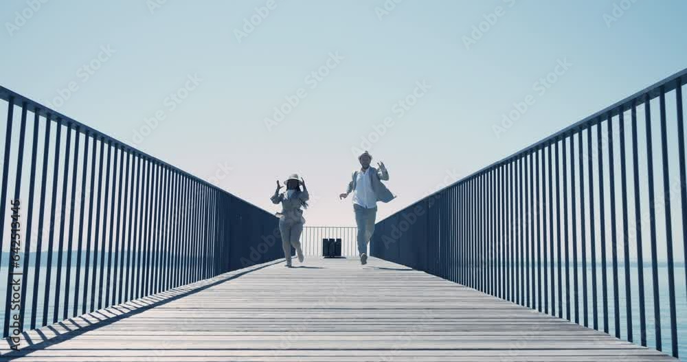 Happy stylish young people running and jumping cheerful having fun Happy stylish young people running and jumping cheerful having fun