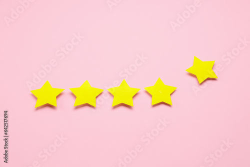 Five stars on pink background. Customer experience concept