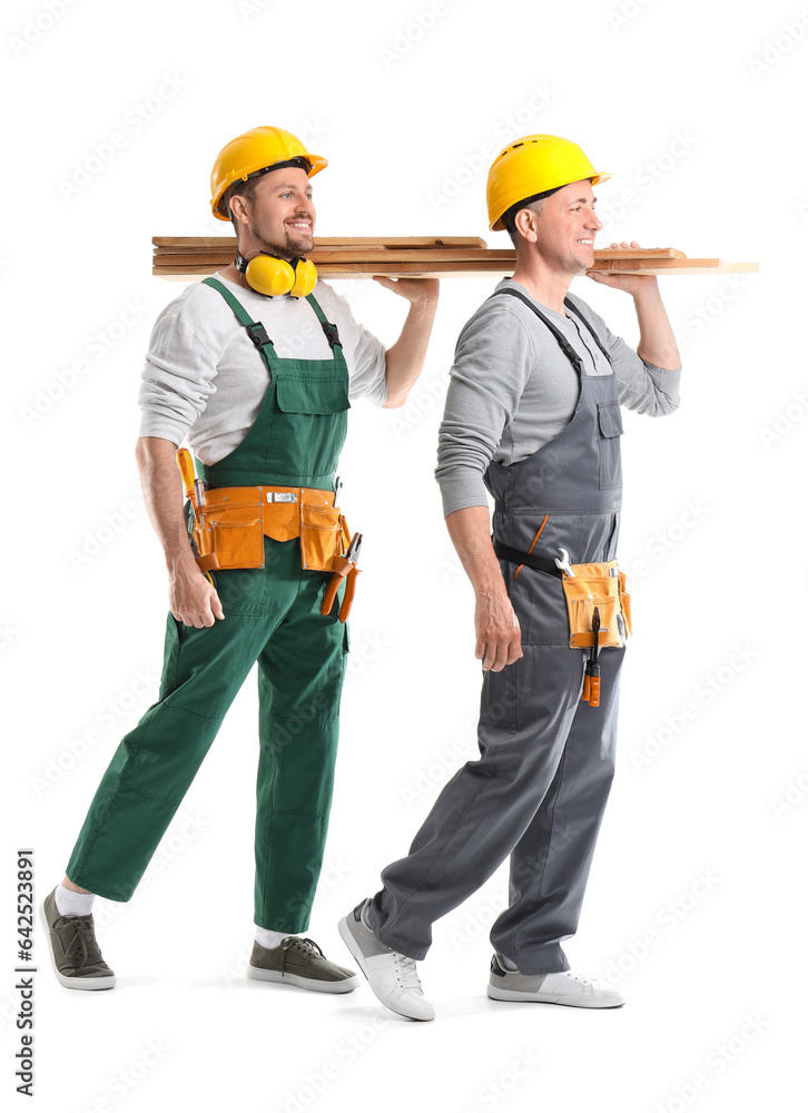 Male builders with wooden planks on white background Male builders with wooden planks on white background