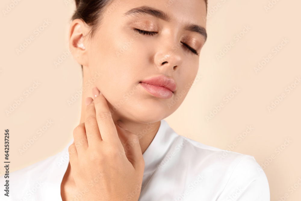 Young woman with beautiful lips on beige background, closeup Young woman with beautiful lips on beige background, closeup