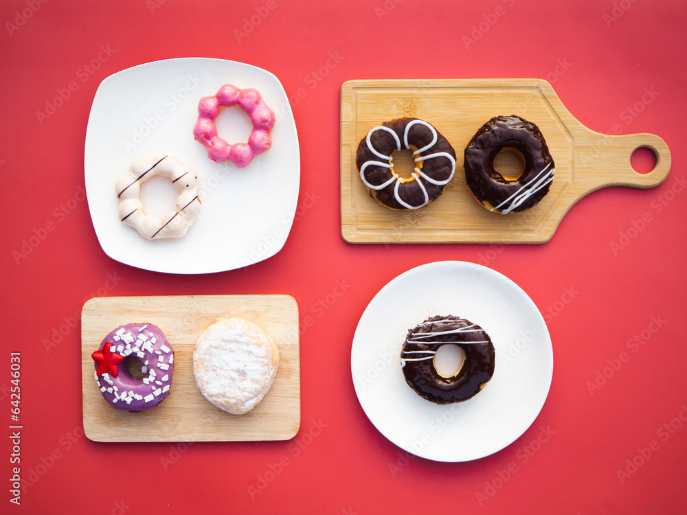 Creative flat lay of delicious glazed donuts Creative flat lay of delicious glazed donuts