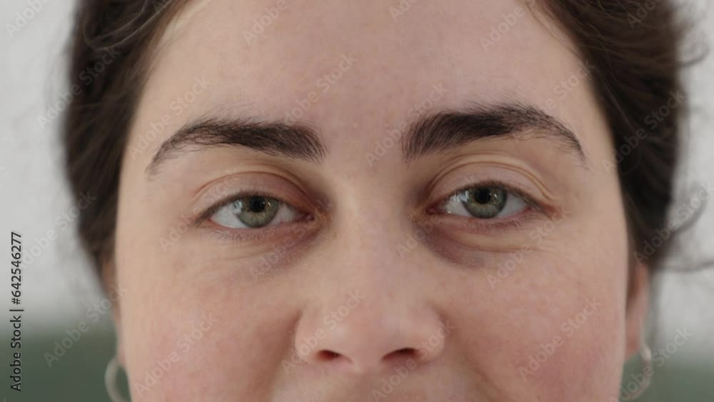 Laser vision correction. Close-up of green eyes of smiling woman. Concept of ophthalmology and eye diseases Laser vision correction. Close-up of green eyes of smiling woman. Concept of ophthalmology and eye diseases