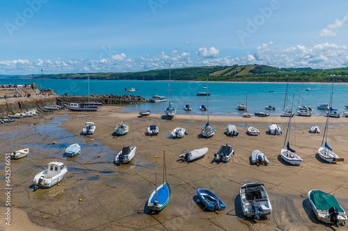 Fototapeta Naklejka Na Ścianę i Meble -  A view over the harbour in the town of New Quay, Wales in summertime