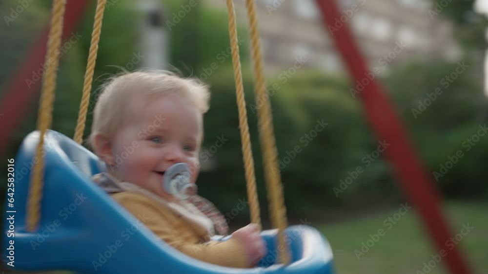 Happy Baby Enjoying A Playful Swing Journey Happy Baby Enjoying A Playful Swing Journey