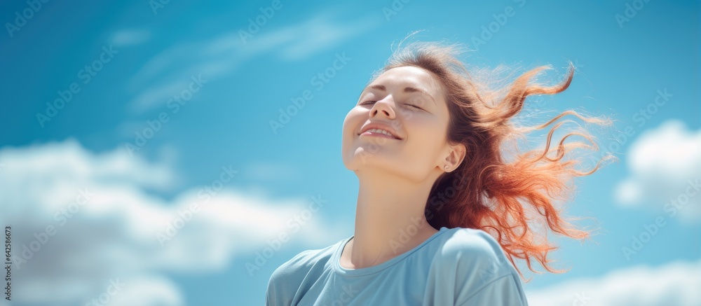 Caucasian woman stretching and relaxing under clear blue sky on bank holiday Caucasian woman stretching and relaxing under clear blue sky on bank holiday