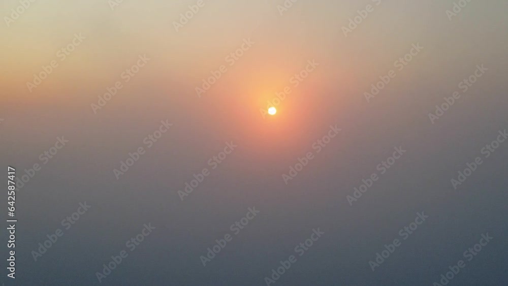 Sunrise, a beautiful sunrise above thick fog on a winter morning in a small town in Brazil, drone scene. Sunrise, a beautiful sunrise above thick fog on a winter morning in a small town in Brazil, drone scene.