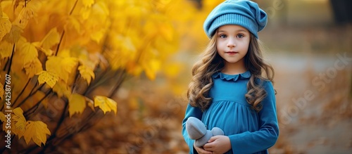 Little girl wearing blue be...