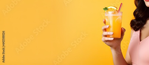 Child and parent enjoying juice on colorful backdrop