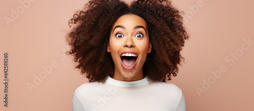 Excited young African woman with OPEN sign above her head